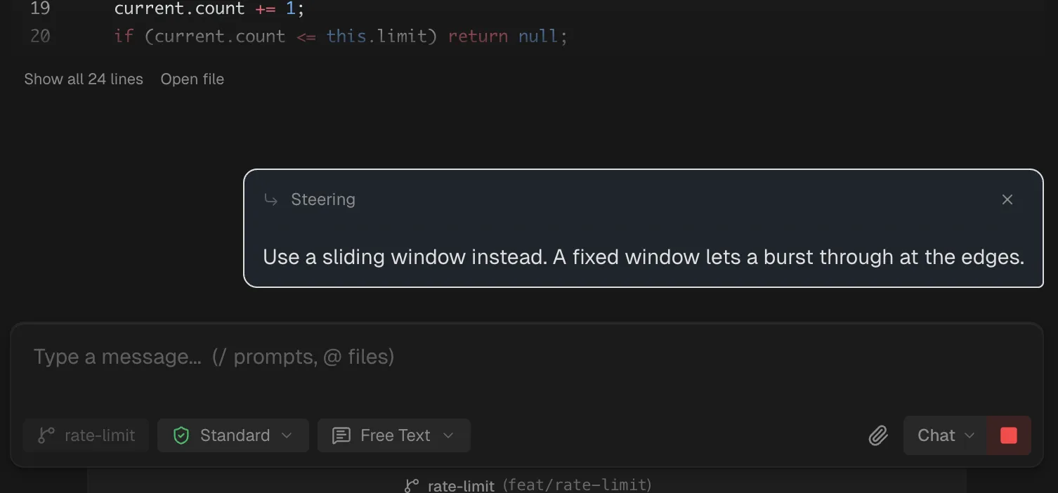 A running agent session: the code the agent is writing, a message marked Steering waiting to enter the turn, and the composer